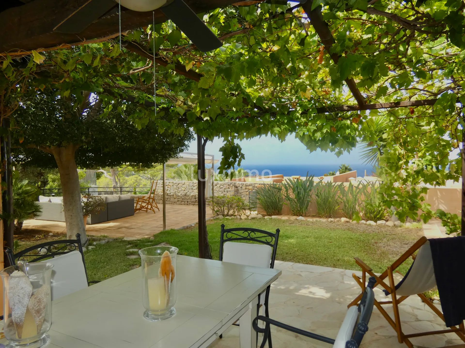 Charming semi-detached house with sea views in Cala Tarida